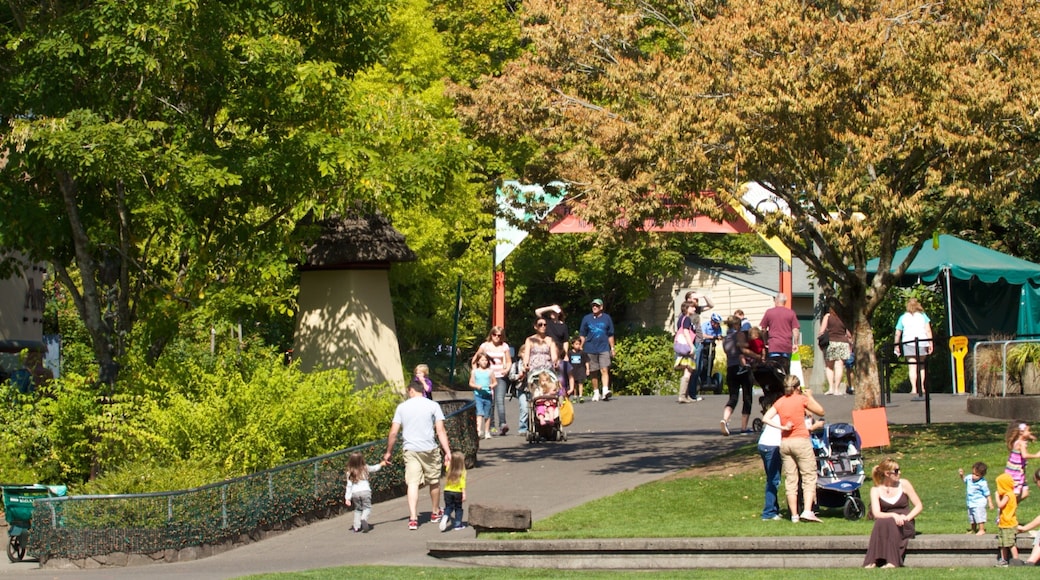 Oregon Zoo featuring landscape views and zoo animals as well as a large group of people