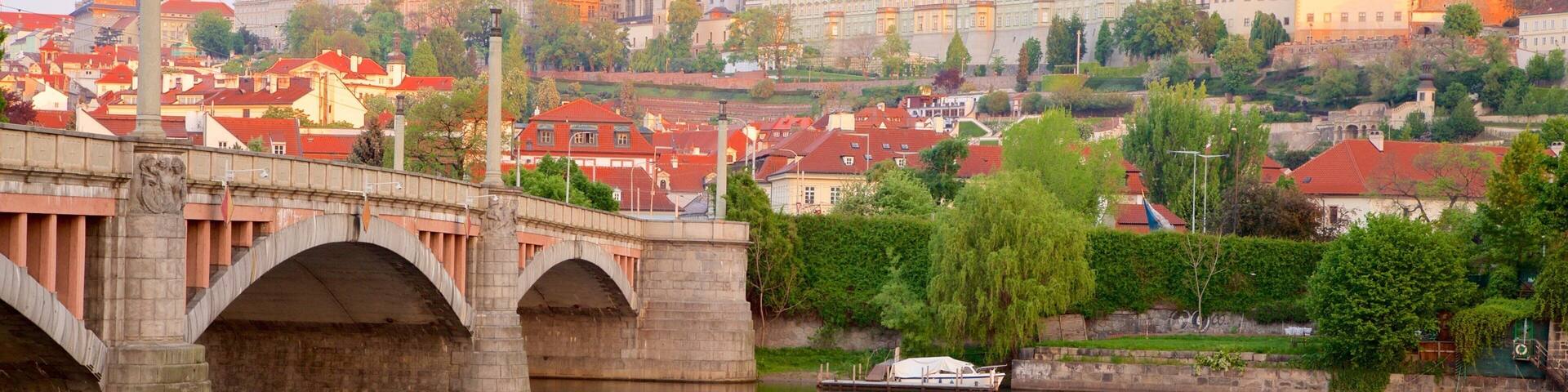 Prague Castle showing a city, a river or creek and a bridge