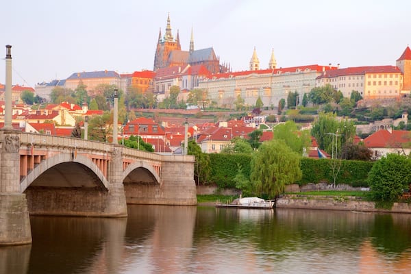 Prague Castle showing a river or creek, a city and a bridge