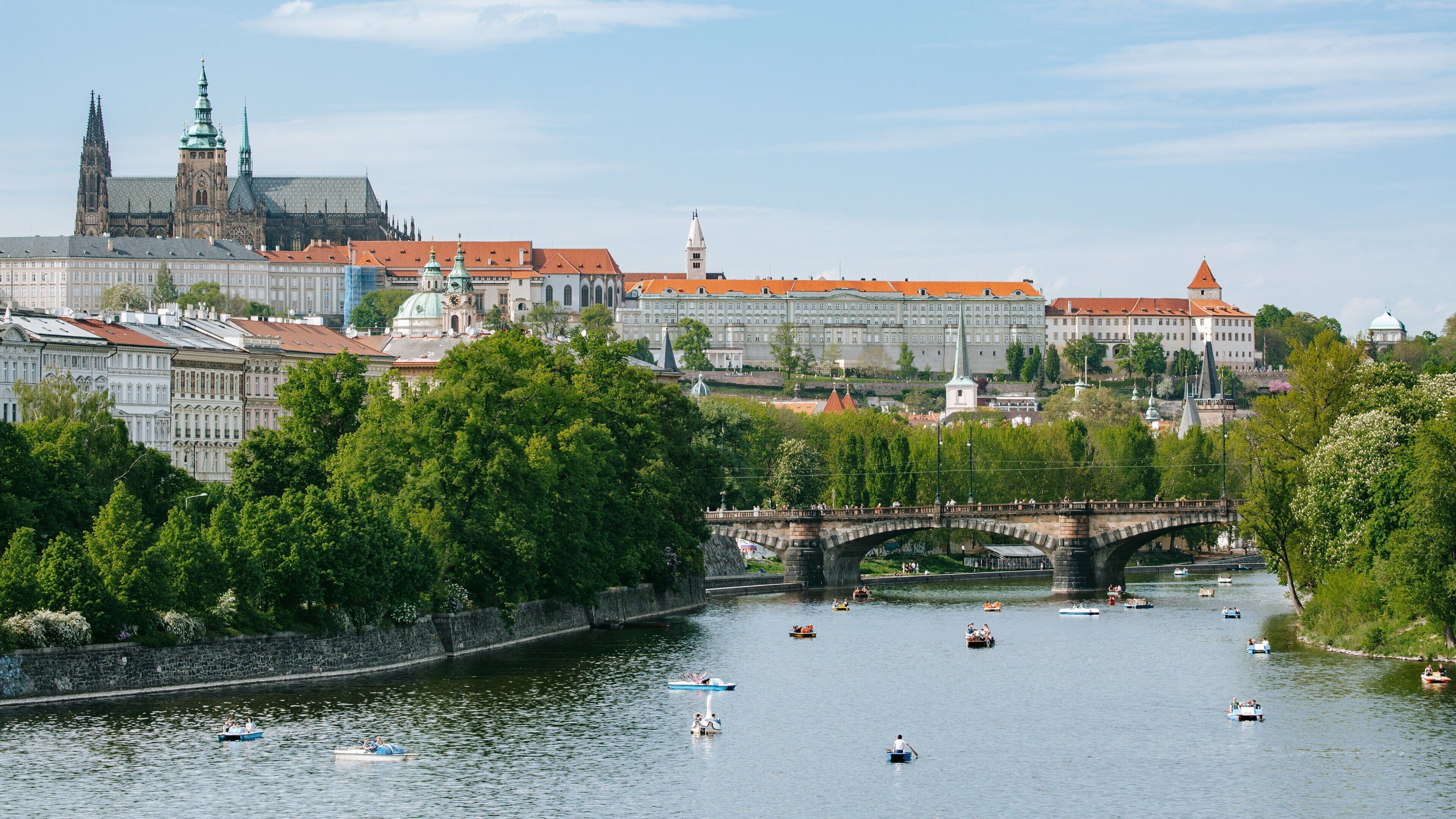 Prague Castle showing a river or creek and boating