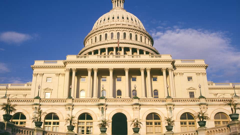 A large, classical building with a prominent dome and columns.