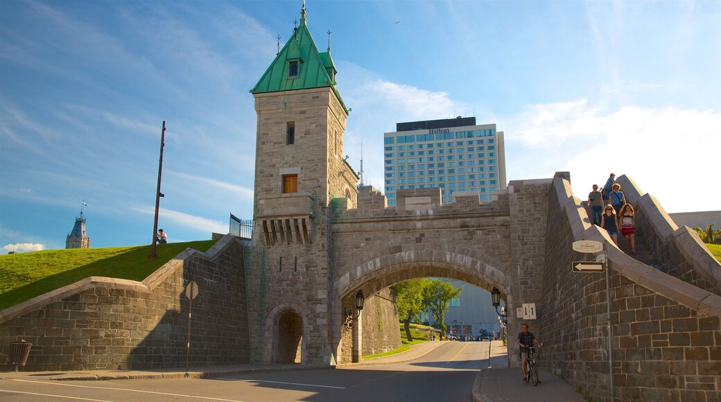 Parliament Building showing a bridge, heritage elements and a sunset