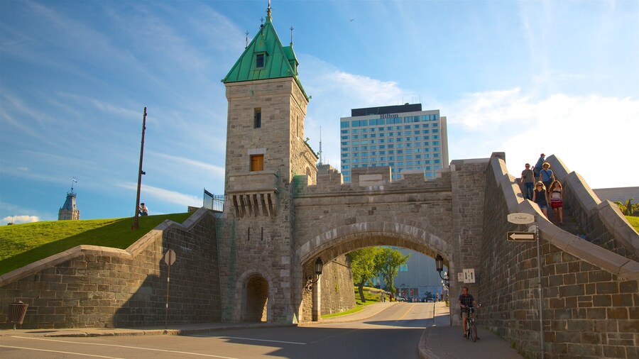 Parliament Building showing a bridge, heritage elements and a sunset