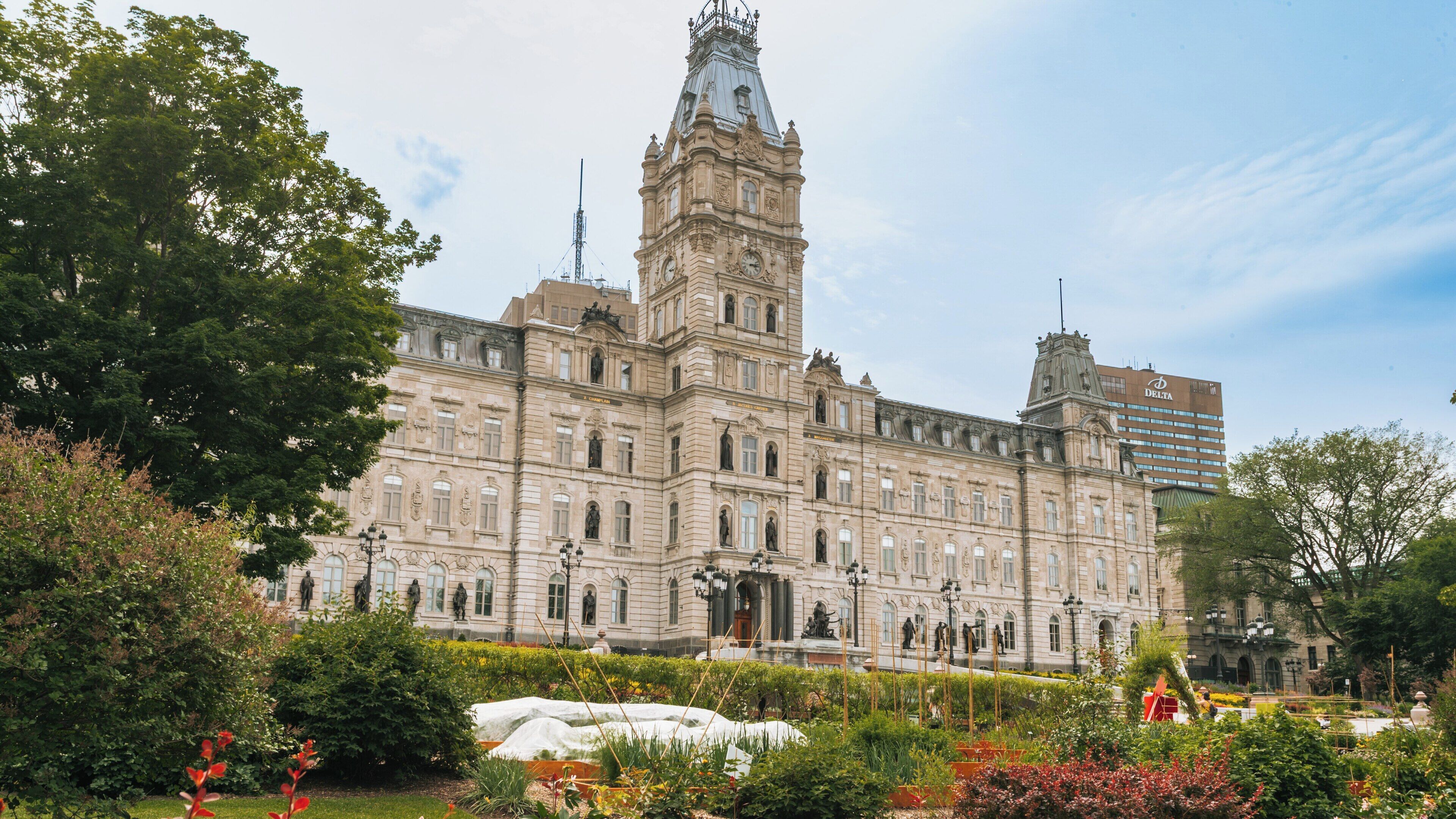 Parliament Building situated on Grande Allee in Quebec City showcases stunning architecture and lush gardens in a vibrant urban landscape