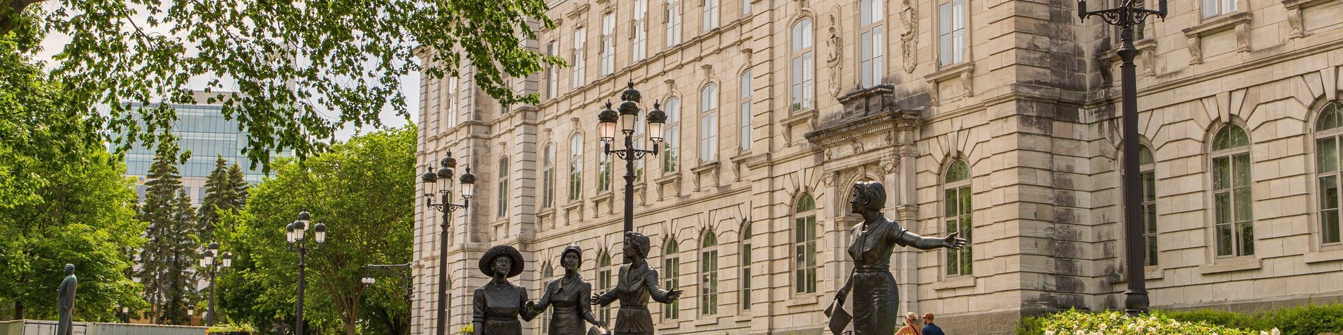 Parliament Building showing a park, a statue or sculpture and wildflowers