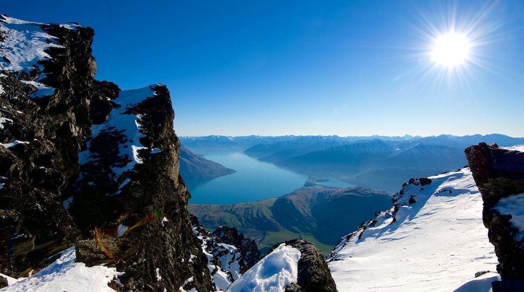 The Remarkables Ski Area showing a river or creek, snow and mountains
