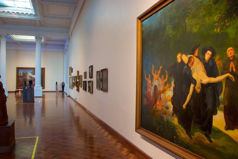 An art gallery with a large painting of a historical scene, wooden floors, and classical architecture.