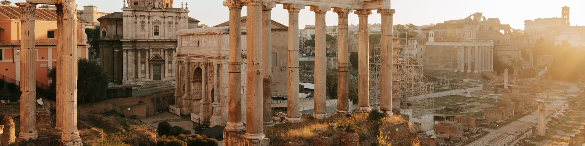 Roman Forum which includes a ruin, heritage elements and a sunset