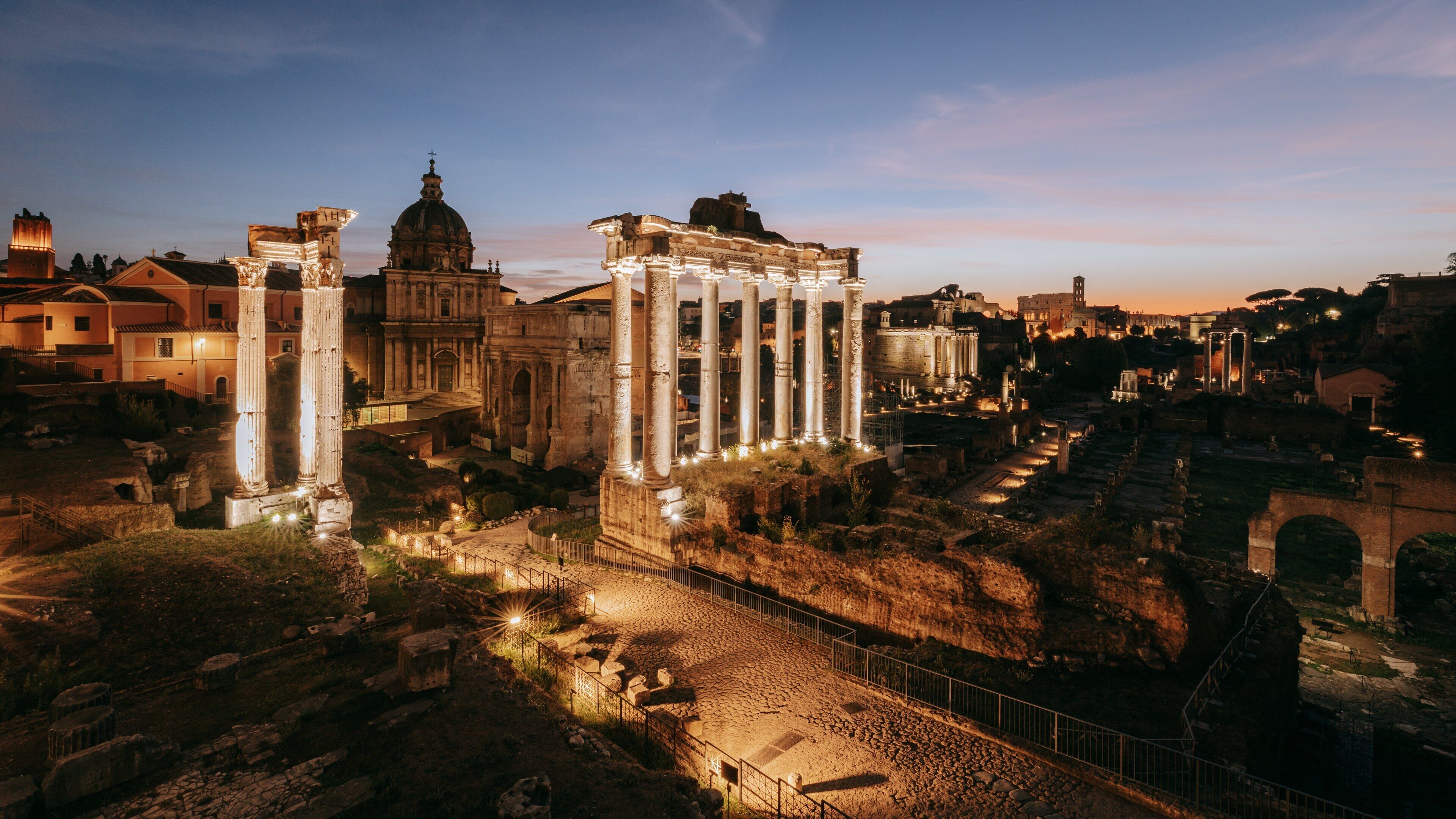 Roman Forum which includes a sunset, night scenes and heritage elements