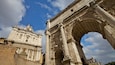 Exploring the grandeur of Roman Forum in Rome, Lazio with ancient architecture under a blue sky