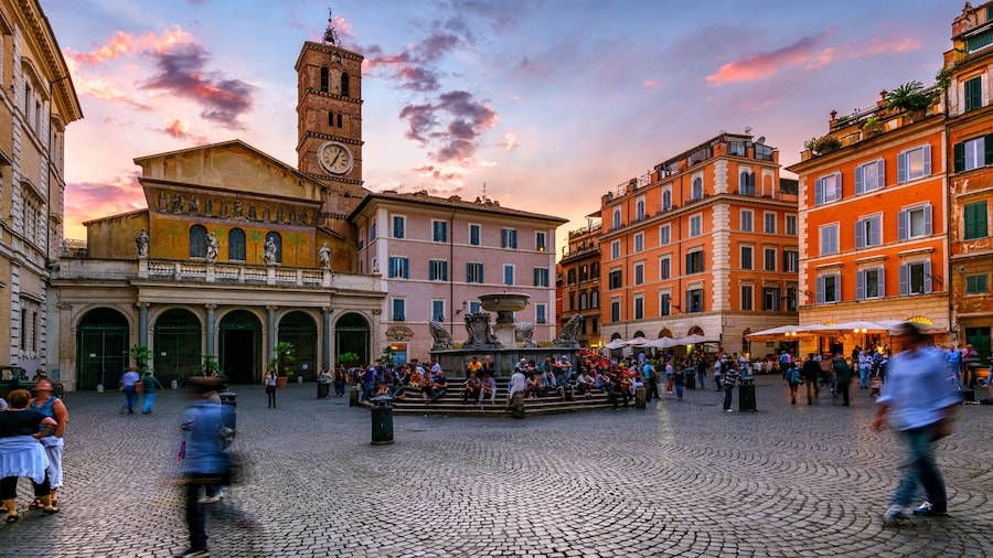 Basilica di Santa Maria in Trastevere and Piazza di Santa Maria in Trastevere at sunset, Rome, Italy. Trastevere is rione of Rome, on west bank of Tiber in Rome. Architecture and landmark of Rome