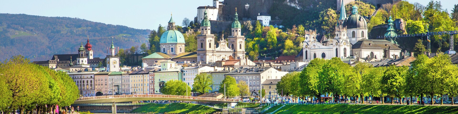 Beautiful view of Salzburg skyline with Festung Hohensalzburg and Salzach river in summer, Salzburg, Salzburger Land, Austria.