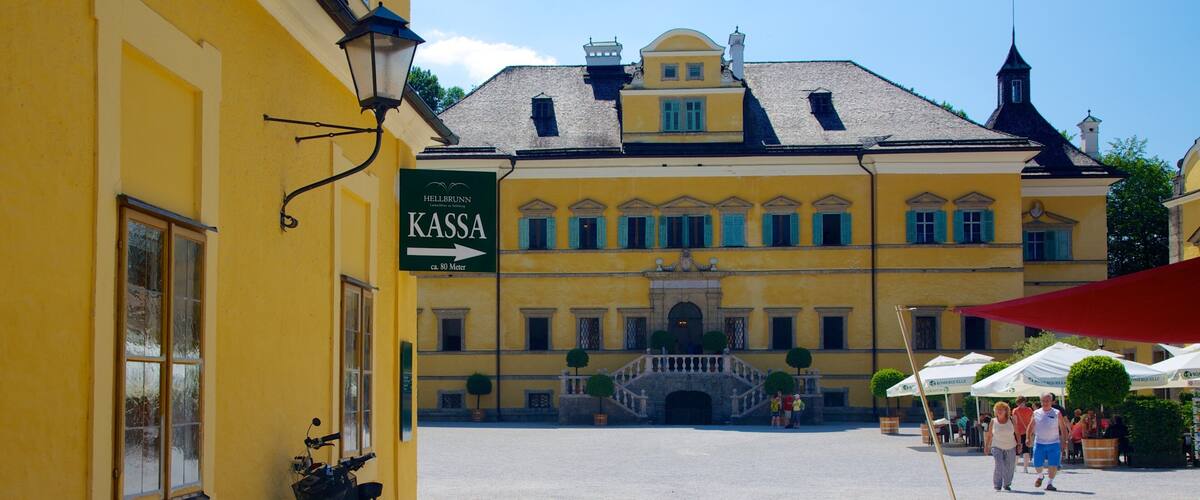 A yellow building with a sign reading "KASSA" and a bicycle parked in front.