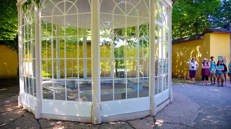 Hellbrunn Palace which includes street scenes and chateau or palace as well as a small group of people