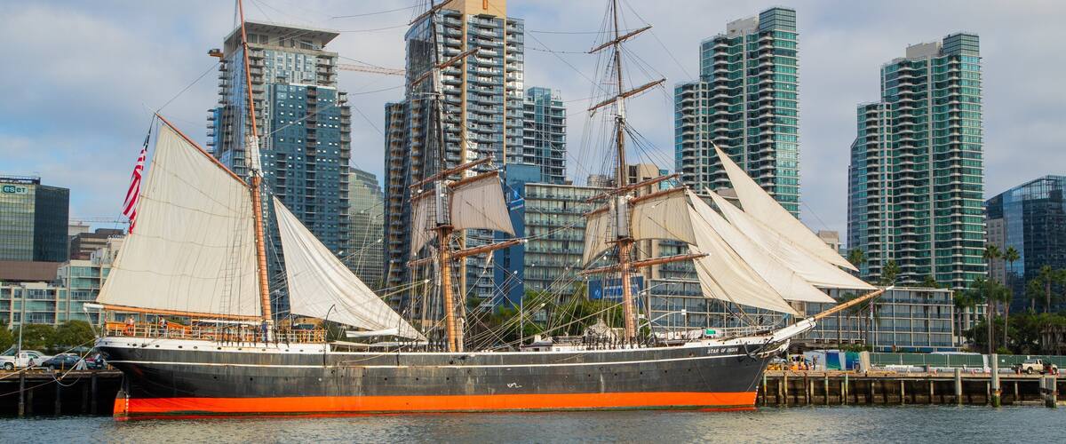 Maritime Museum of San Diego featuring a bay or harbor, heritage elements and a city