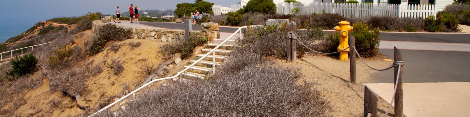 Cabrillo National Monument featuring a monument, a lighthouse and landscape views