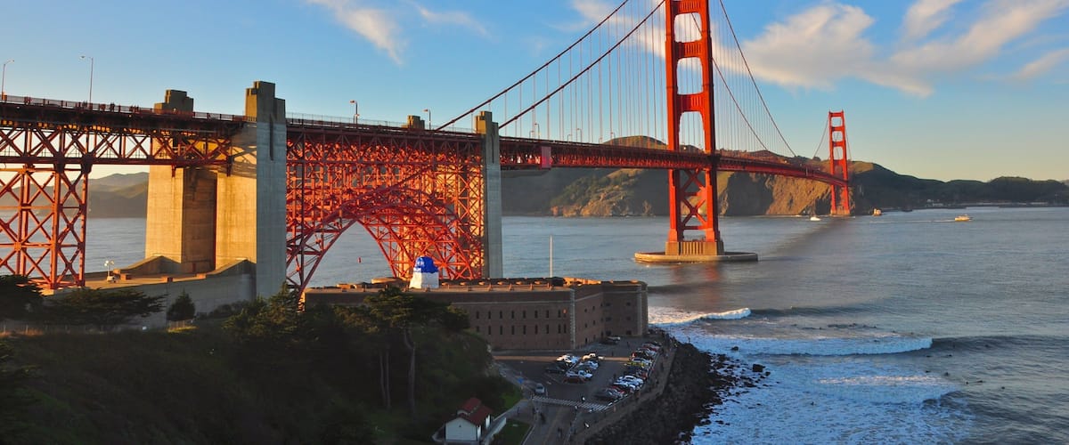 Presidio of San Francisco showing a bridge, a bay or harbour and heritage architecture