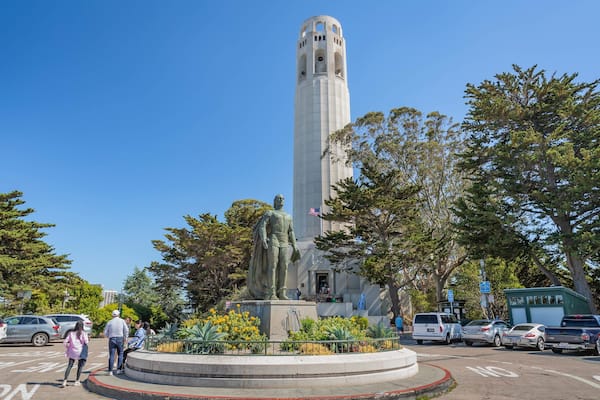 Coit Tower which includes a statue or sculpture and a square or plaza
