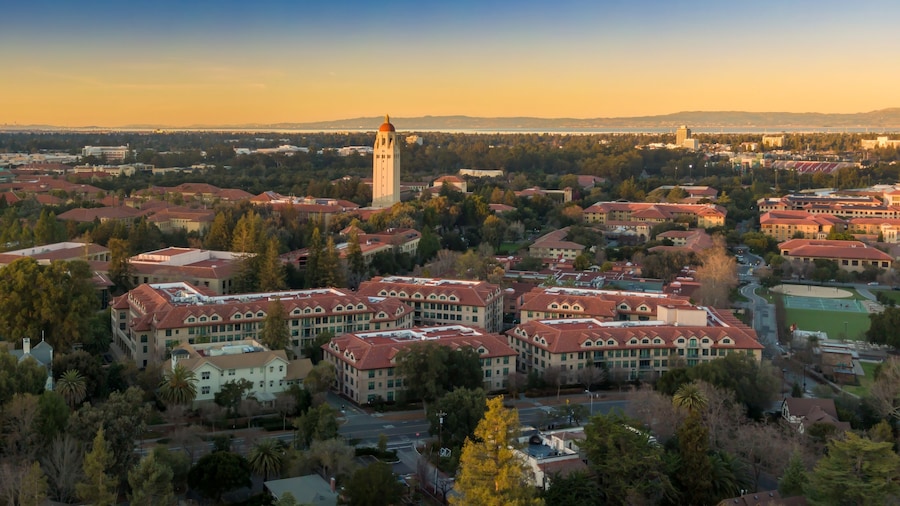Aerial view of Stanford University campus showcasing the iconic Hoover Tower and surrounding buildings at sunset. Palo Alto, California, USA. 28 December 2024.