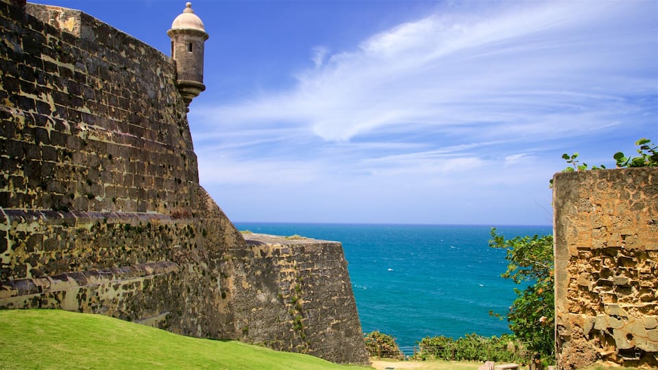 A coastal fort with a tower overlooking the sea.