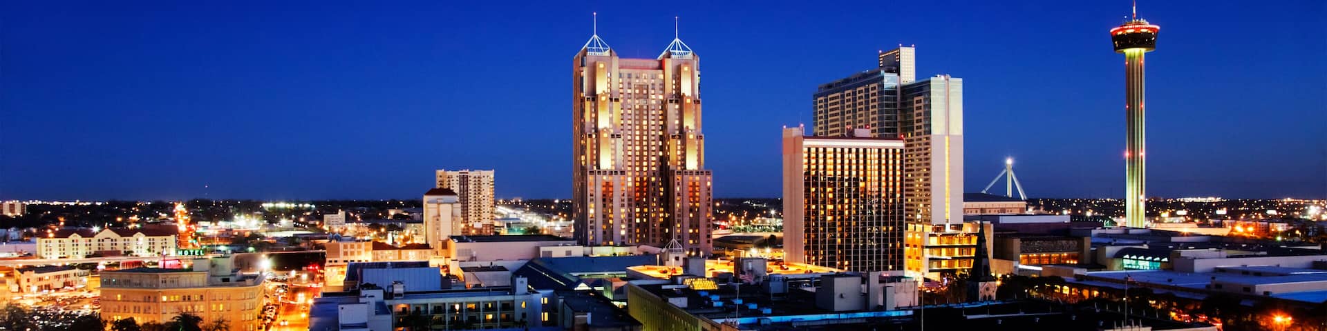 San Antonio downtown just after sunset showing skyline around Tower of the Americas & city lights; Shutterstock ID 120141397