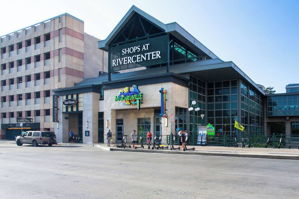 A shopping center with a sign reading "Shops at Riverview Center" and a "Yard House" sign.