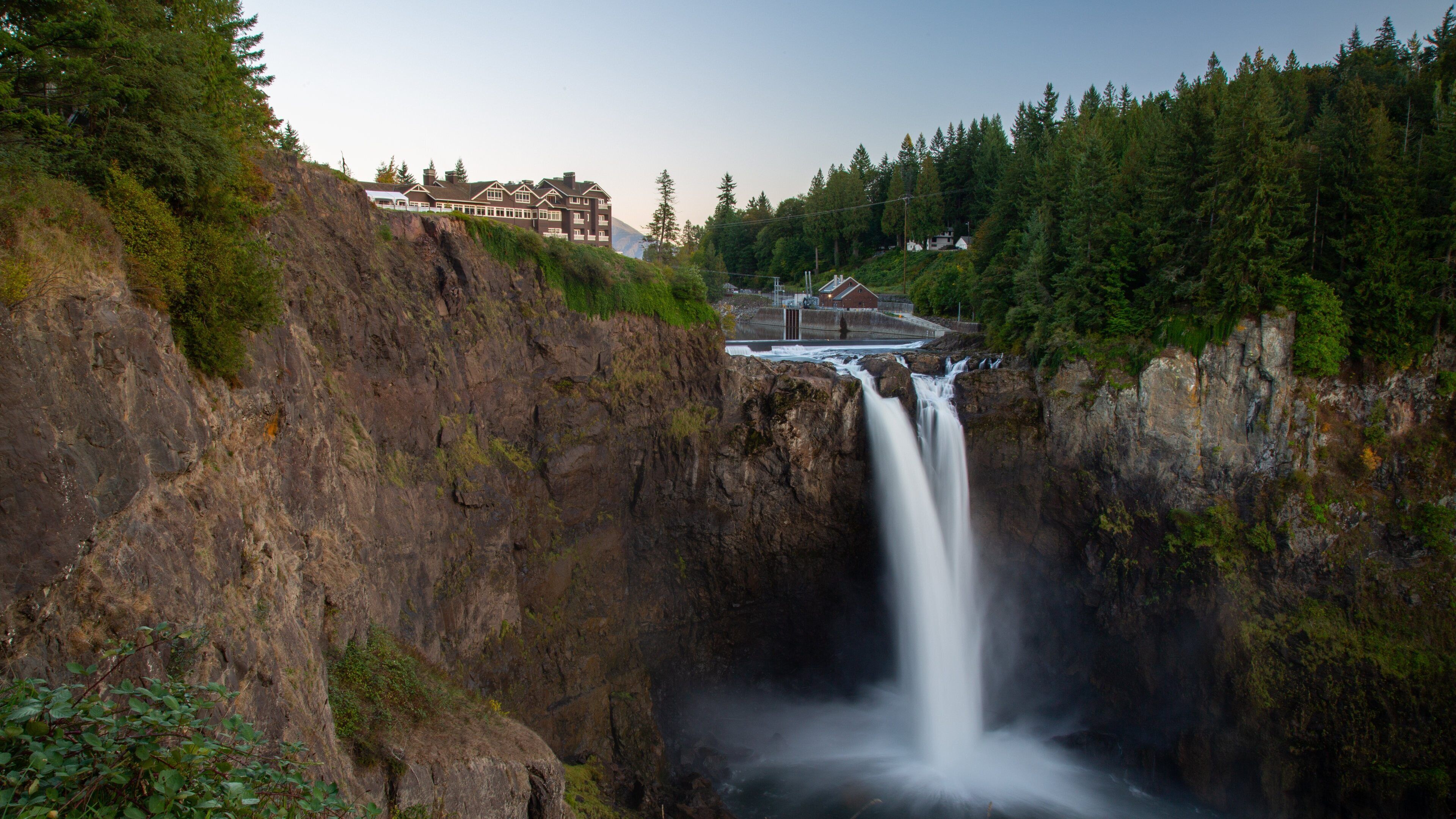 Snoqualmie Falls showing a cascade and a sunset
