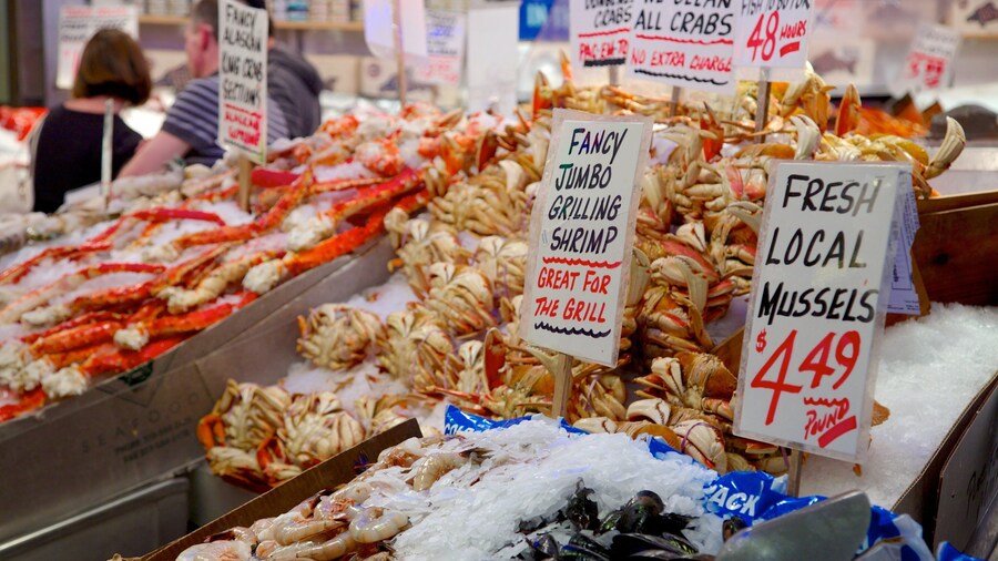 Pike Place Market featuring markets, food and signage