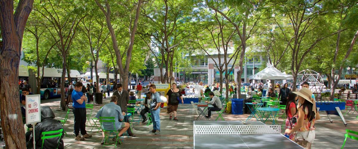 Westlake Center featuring a square or plaza as well as a small group of people