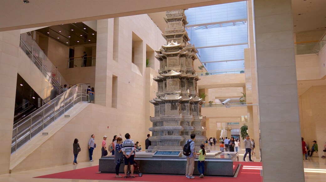 National Museum of Korea featuring interior views and heritage elements as well as a small group of people