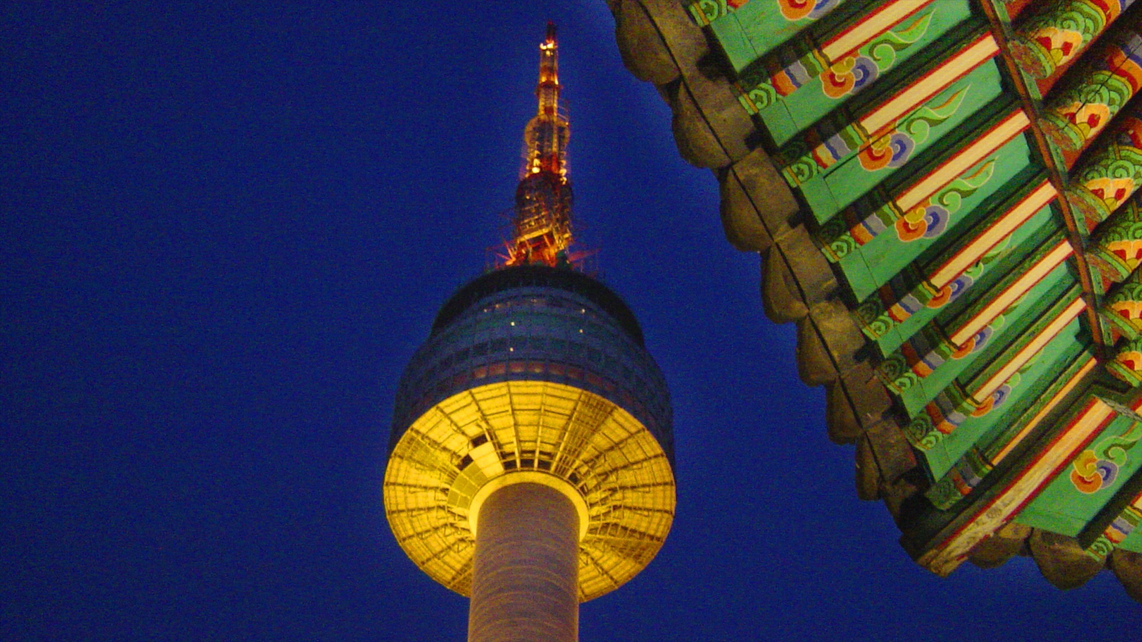 N Seoul Tower featuring a city, a skyscraper and night scenes