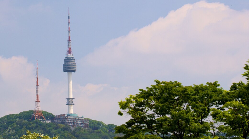 N Seoul Tower showing a skyscraper and a sunset