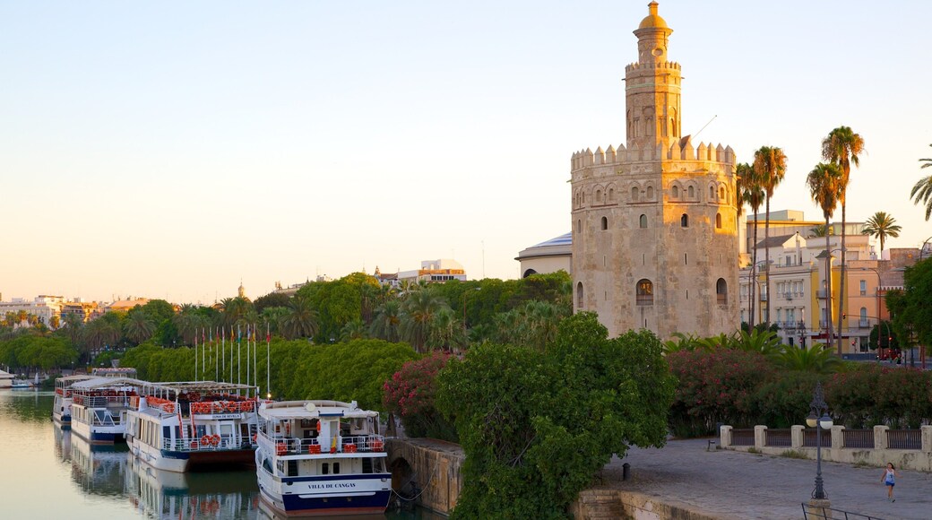Torre del Oro Watchtower showing military items, a bay or harbour and a river or creek