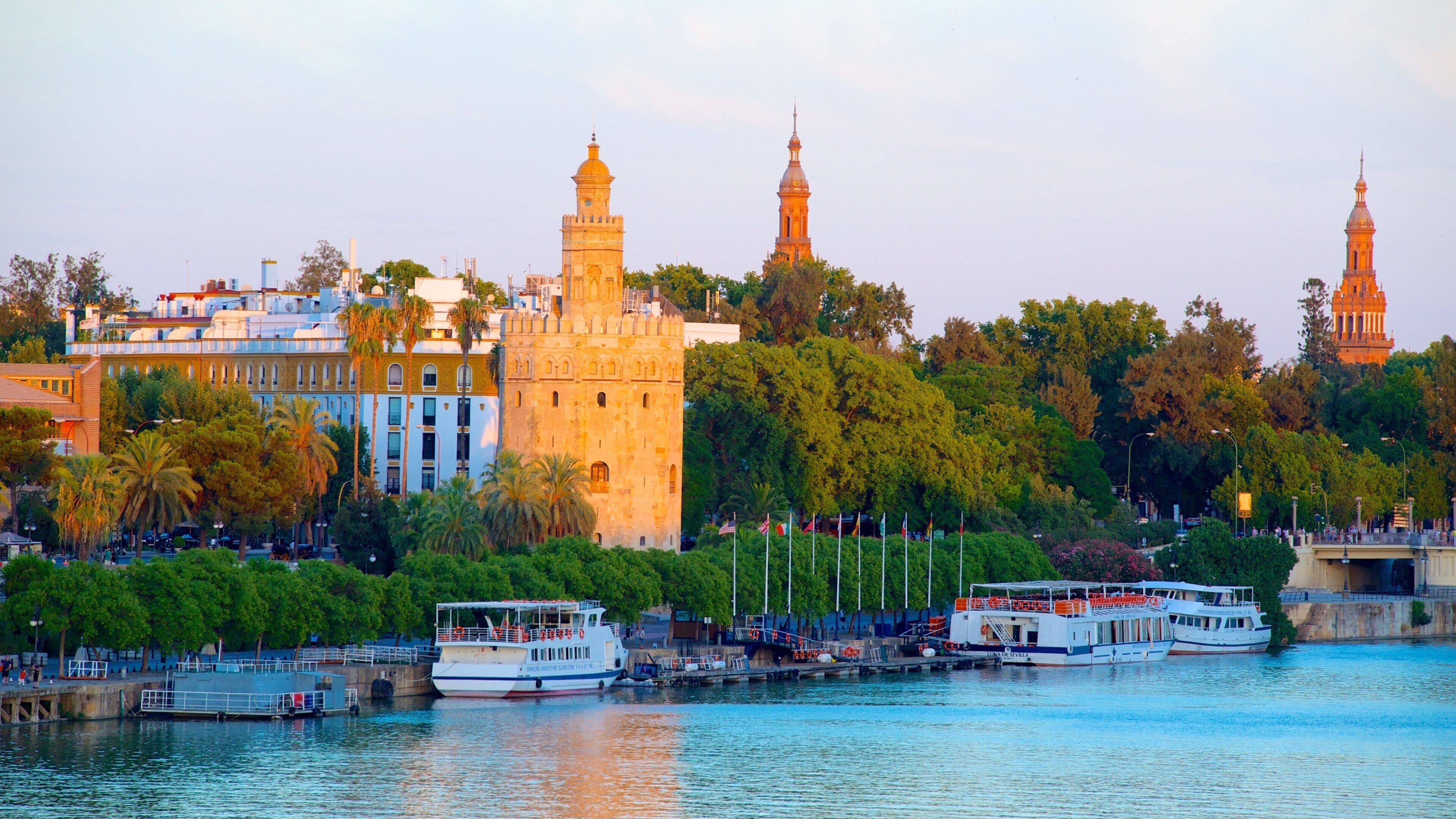 Torre del Oro Watchtower featuring heritage architecture, a river or creek and a bay or harbor
