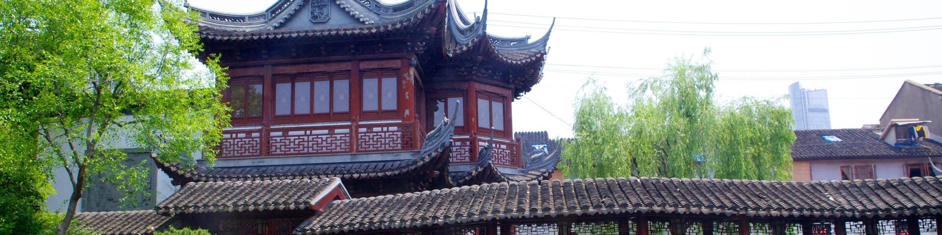 Yu Yuan Garden featuring heritage architecture, a pond and a park