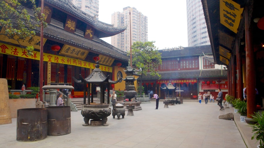 Jade Buddha Temple which includes a square or plaza, a temple or place of worship and religious aspects