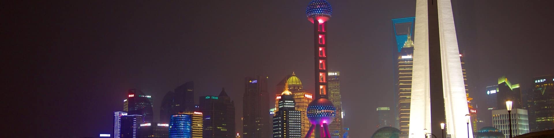 Oriental Pearl Tower showing night scenes and a city