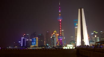 Oriental Pearl Tower which includes a city and night scenes