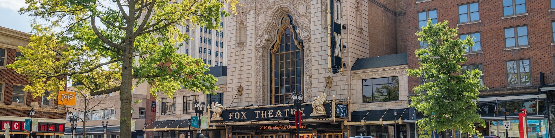 Fox Theater showing signage, a garden and a city