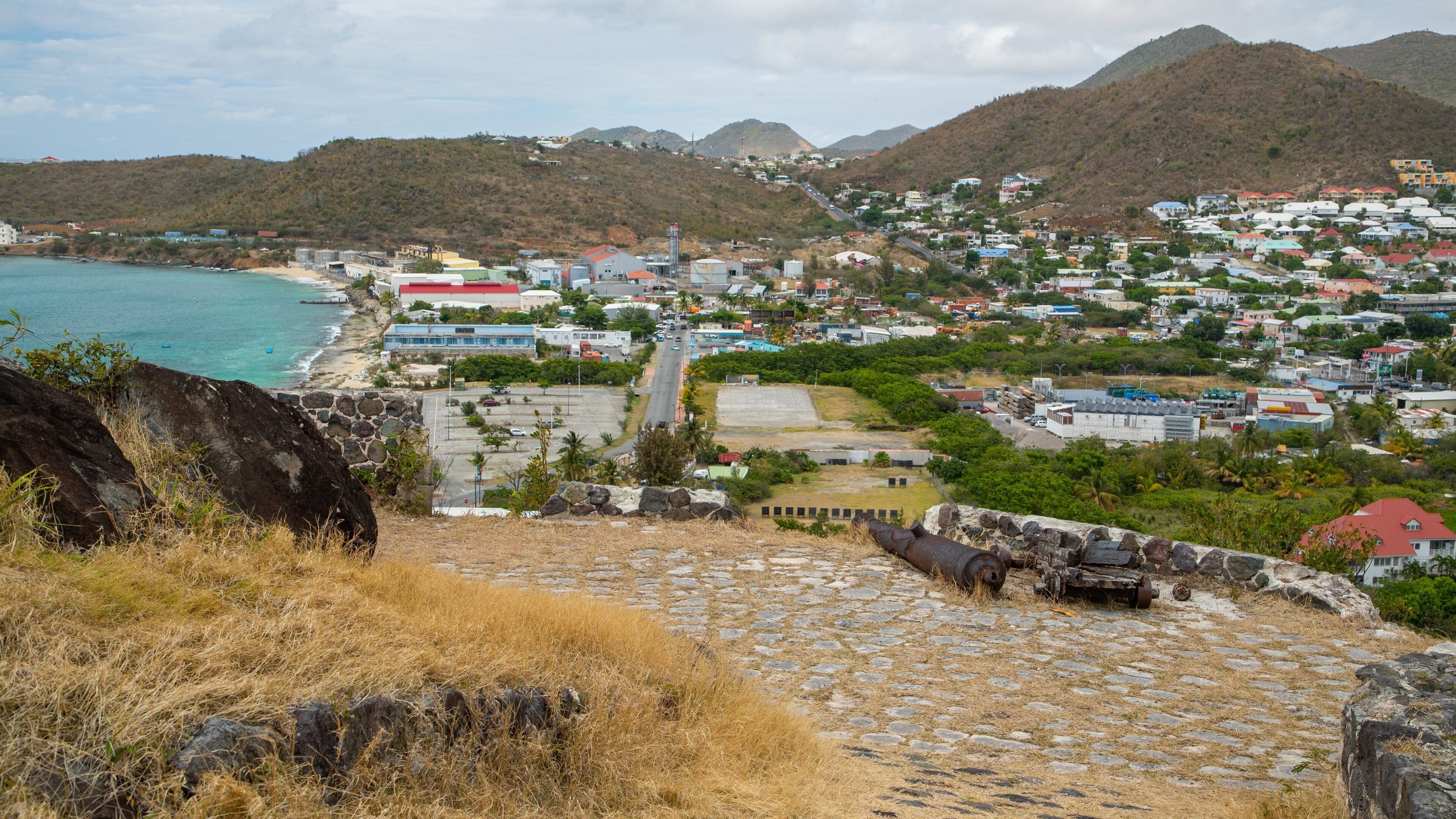 Fort St. Louis showing landscape views, heritage elements and a coastal town