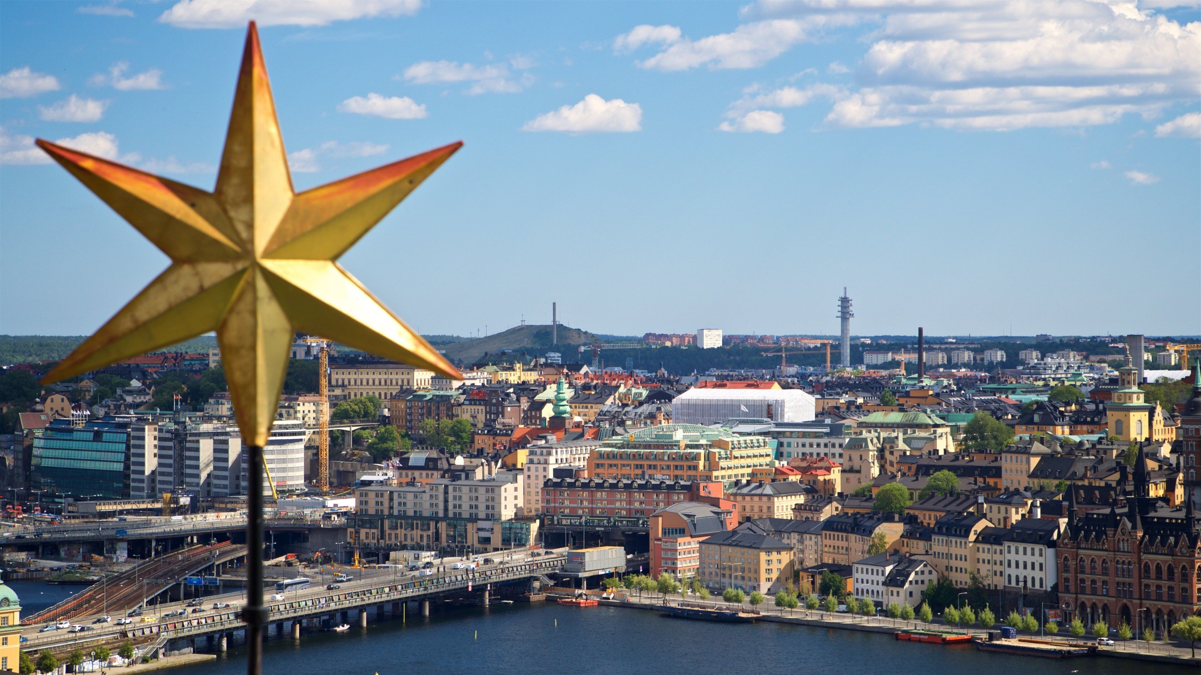 Stockholm City Hall showing landscape views, a river or creek and a city