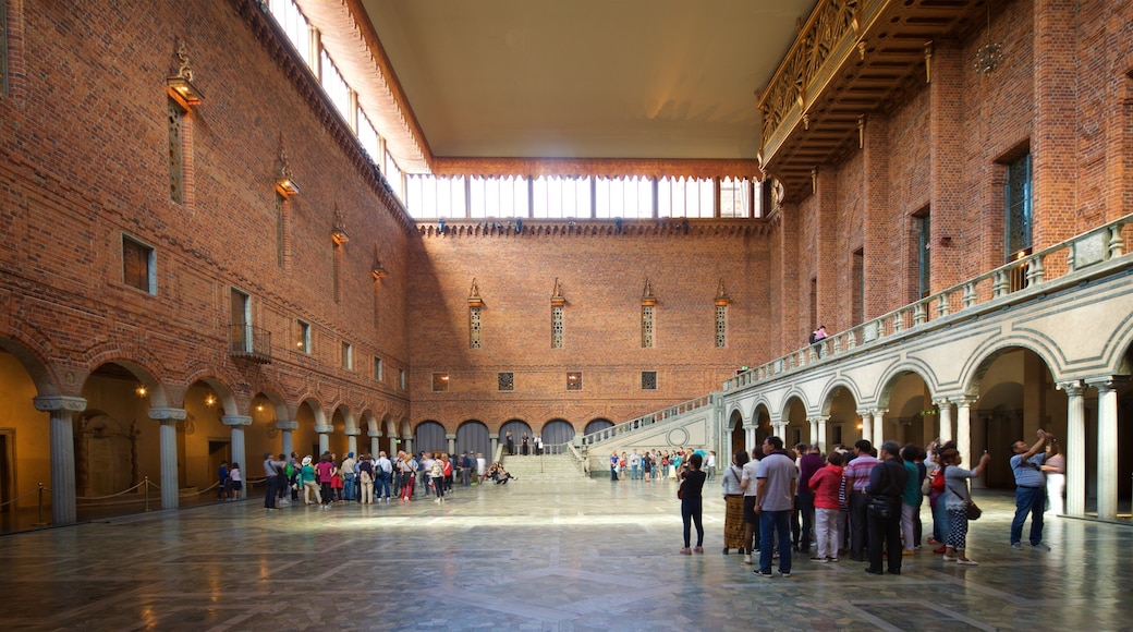Stockholm City Hall which includes heritage elements and interior views as well as a small group of people