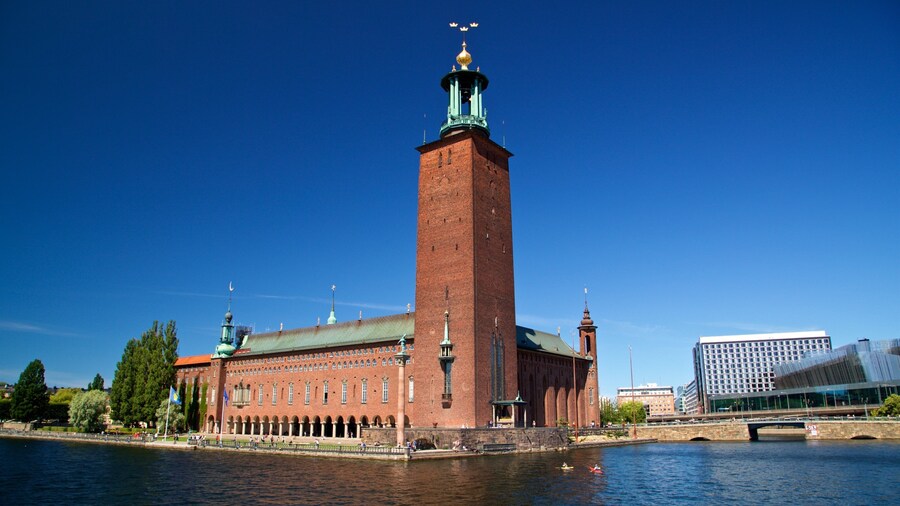 Stockholm City Hall which includes a bay or harbor and heritage architecture