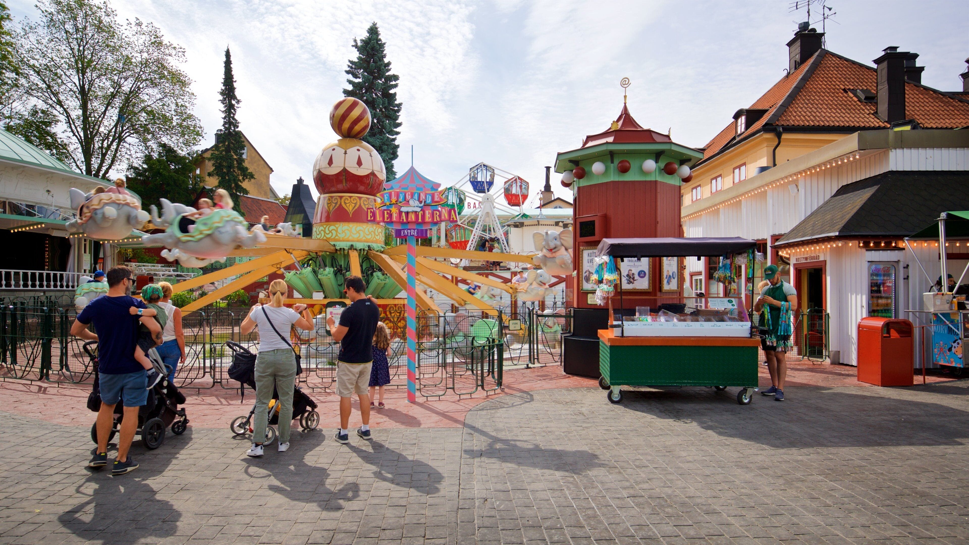 Tivoli Grona Lund featuring rides as well as a small group of people