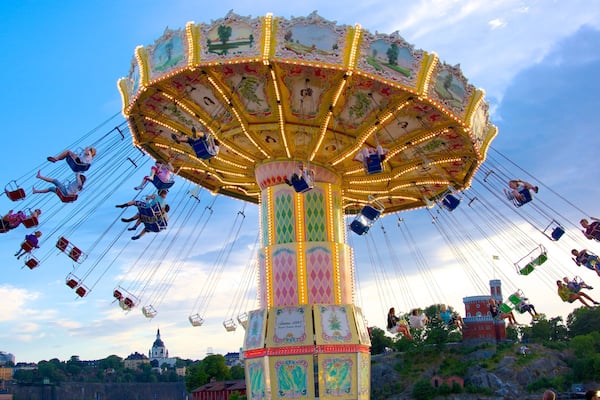 Tivoli Grona Lund showing rides as well as a large group of people