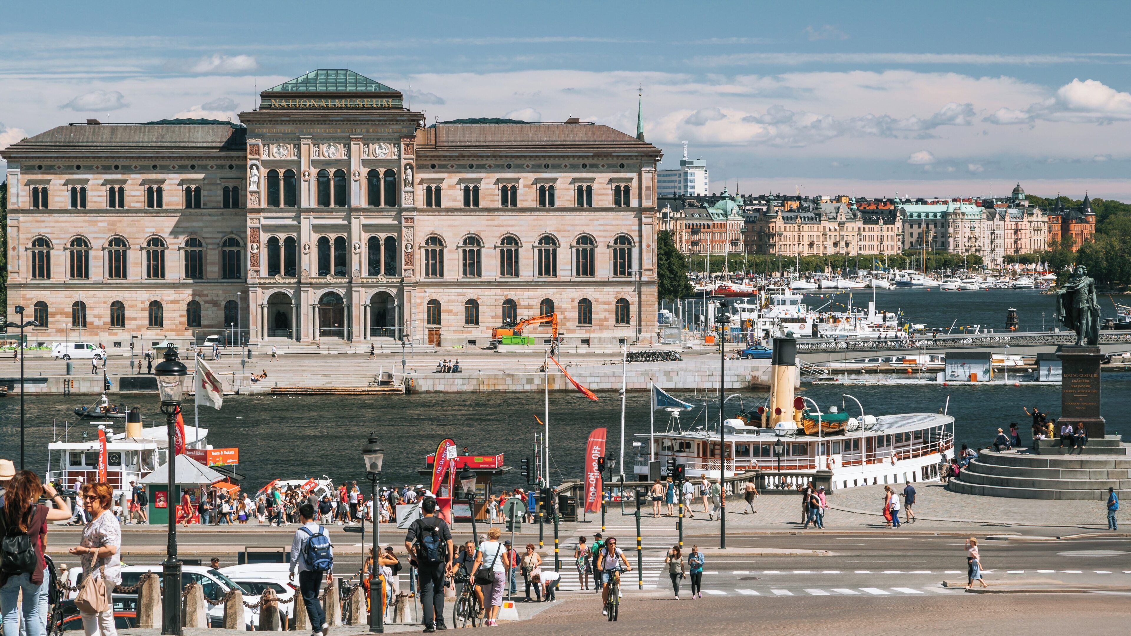 National Museum in Central Stockholm showcasing architectural beauty and vibrant waterfront activity during a sunny day