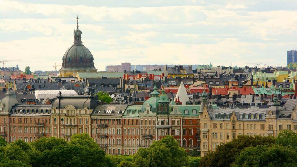 A cityscape with historic buildings, a prominent dome, and a dense urban layout.