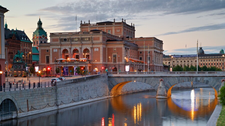 Royal Swedish Opera featuring a bridge, a river or creek and a sunset