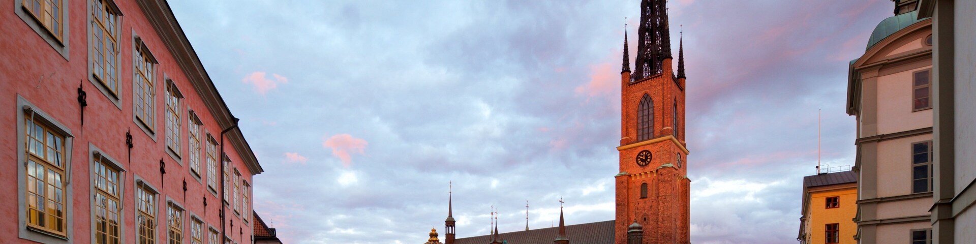 Riddarholmen Church showing a square or plaza, a sunset and a city