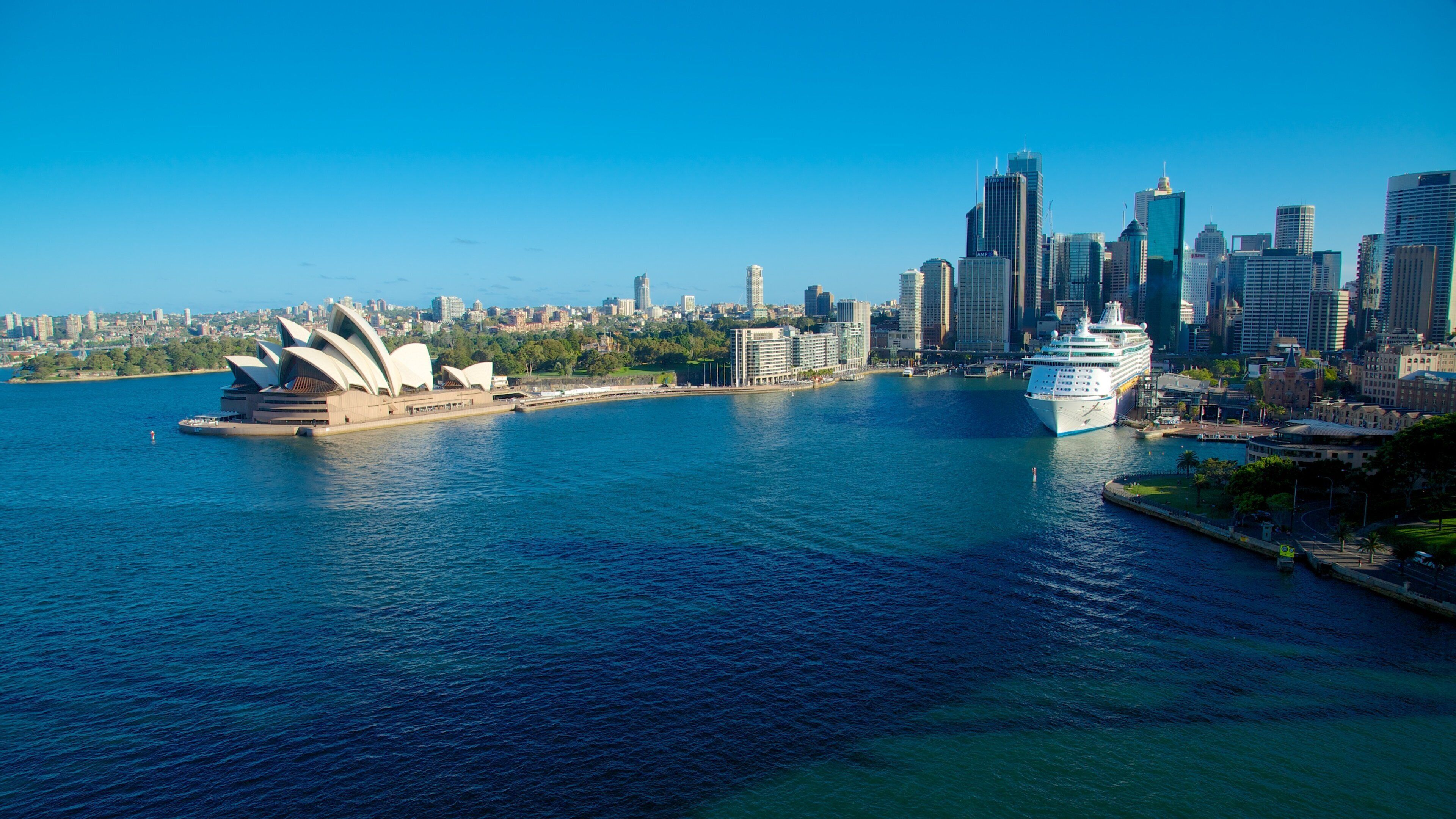Circular Quay featuring a bay or harbor, a city and modern architecture